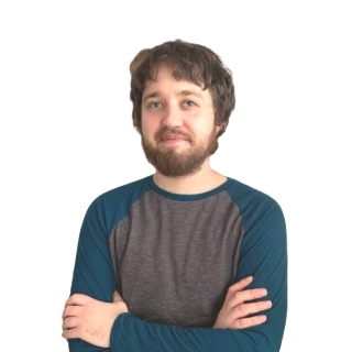 Image of a man standing in front of a white background