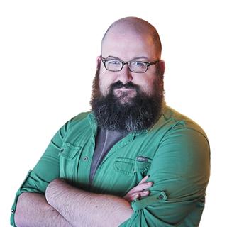 Image of a man standing in front of a white background