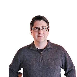 Image of a man standing in front of a white background